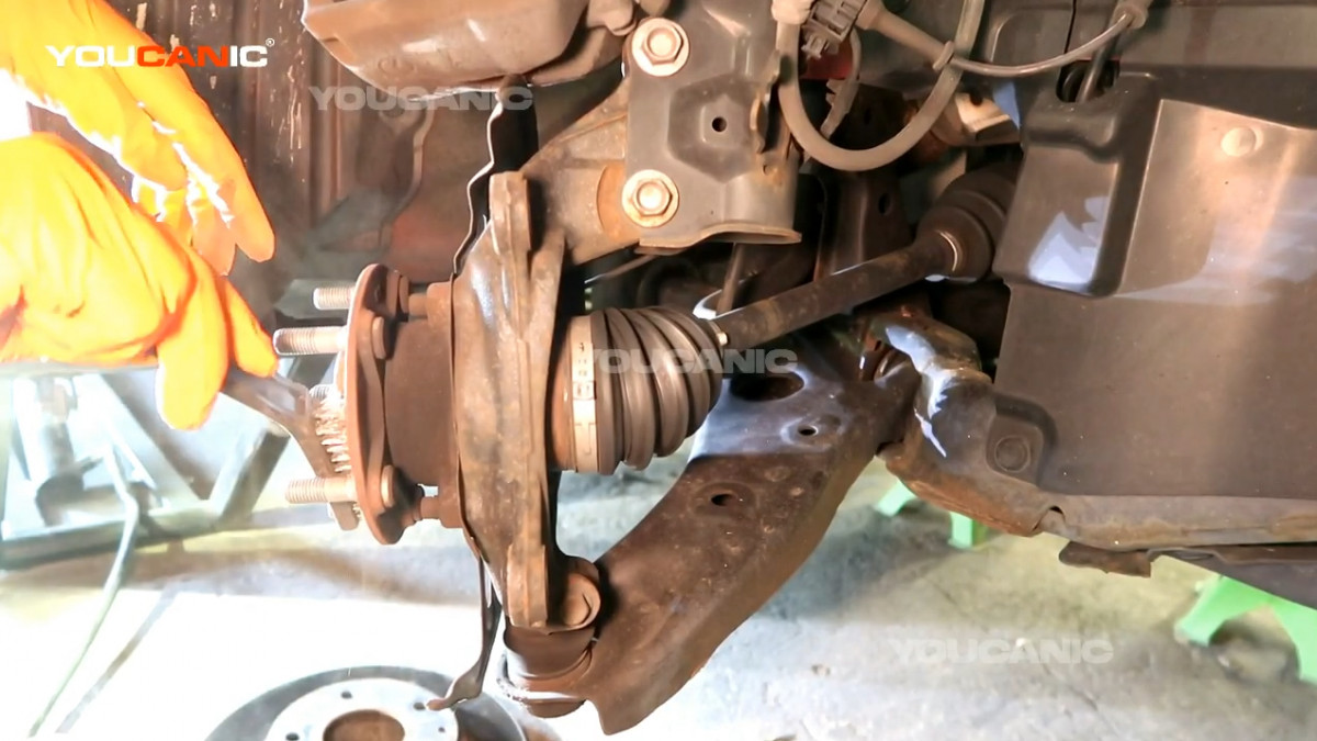 Cleaning the rotor installation port using a wire brush.