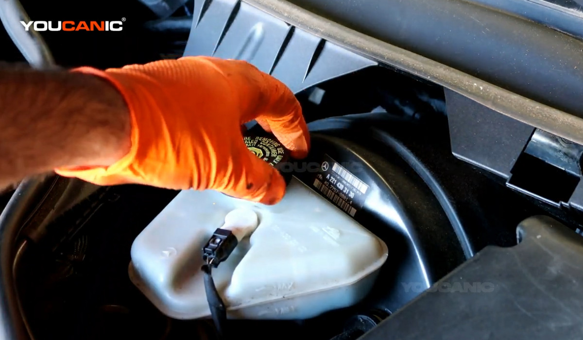 Closing the brake fluid cap.