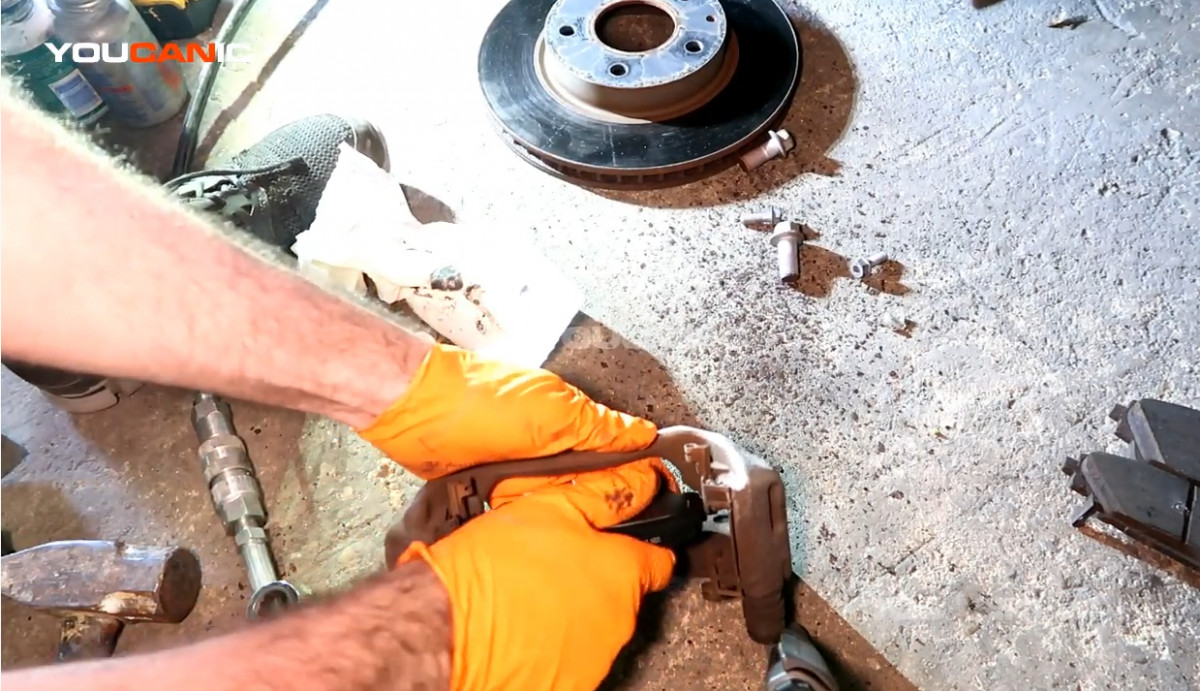 Installing the new brake pad to the carrier.