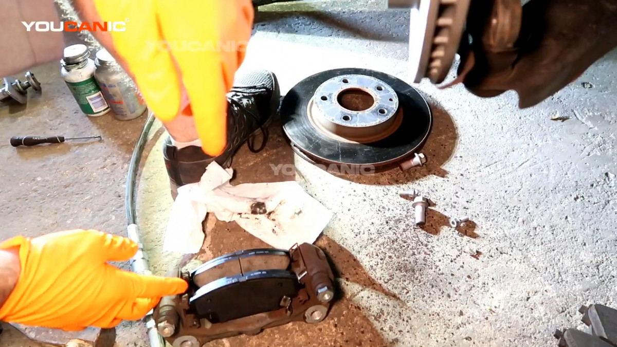 Installing the new brake pad to the carrier.