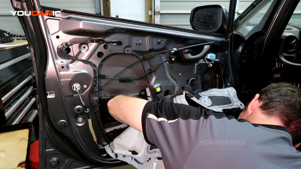 Reinstalling the three 10mm bolts on the bottom.