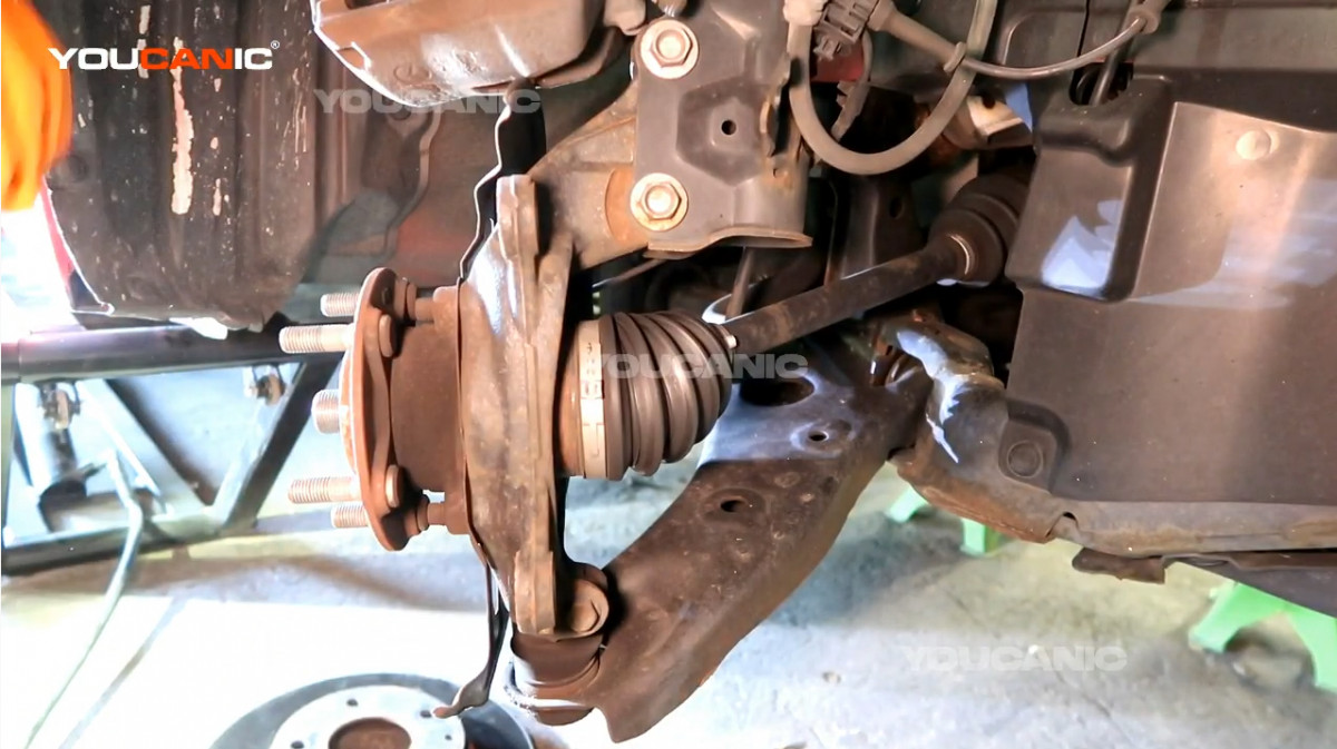 Removing the rotor out from the vehicle.