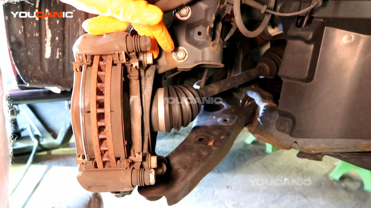 Setting the piston caliper aside.