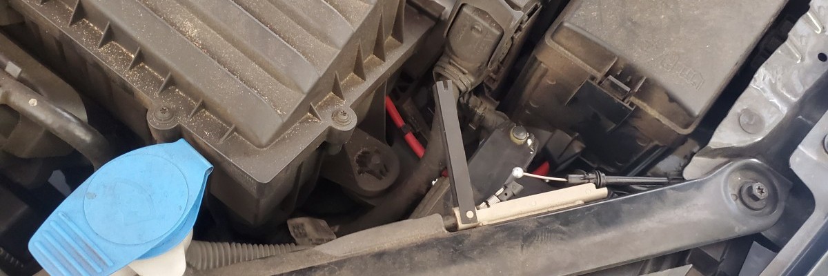 The hood release union on MK7 GTI above the drivers headlamp