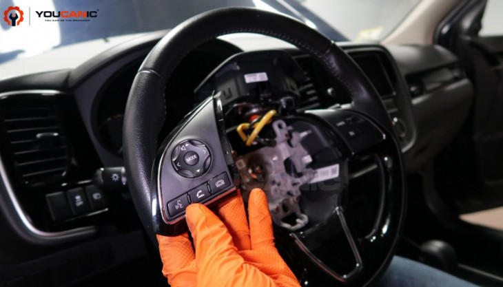 How to Remove and Replace the Steering Wheel Buttons on a Mitsubishi Outlander.