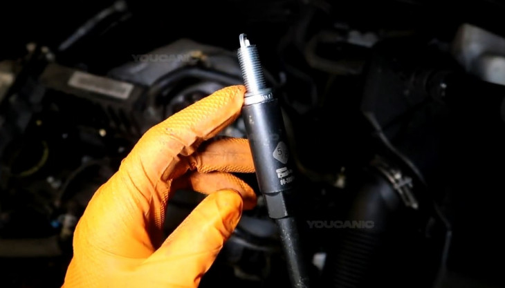 Installing the new spark plug and coil pack of the 2016-2020 Kia Optima.