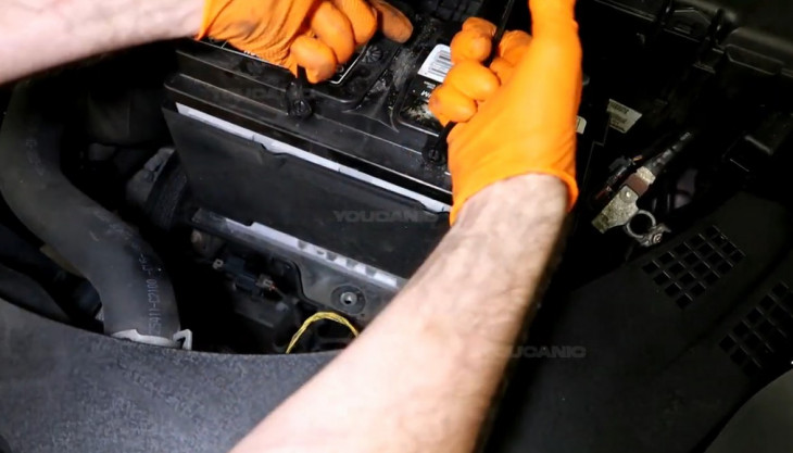 Replacing the old battery of the 2016-2020 Kia Optima.